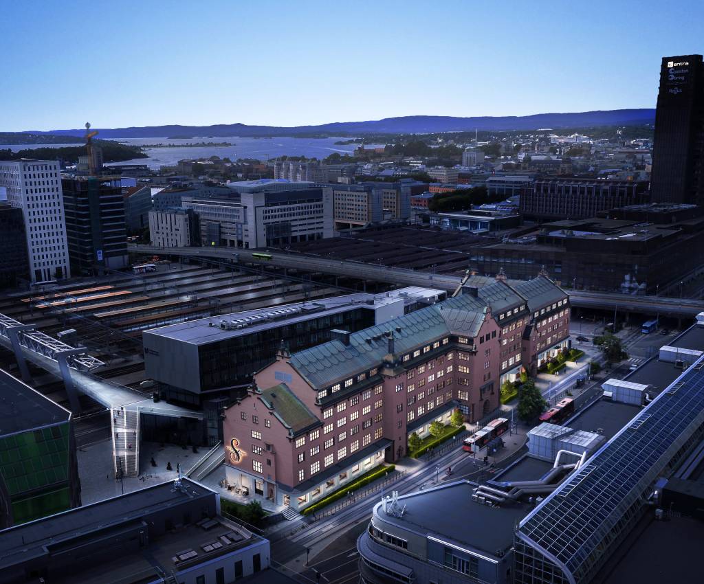 Tollgaarden har vært en del av Oslos bybilde de siste 100 årene. Entra er i full sving med å bygge moderne og fleksible arbeidsfellesskap i denne historiske bygningen, og i 2024 flytter Amedia inn. Illustrasjon: 3D Estate